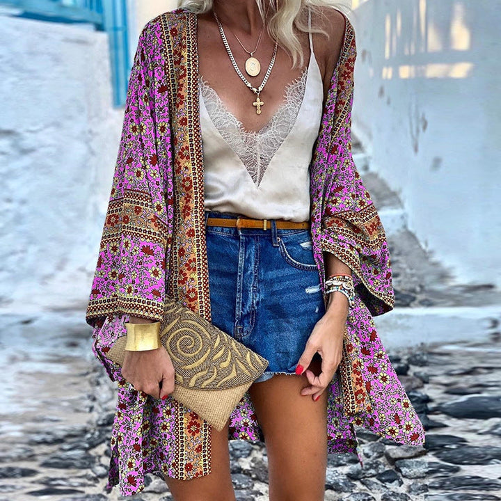 Long-sleeve women's boho cardigan, vibrant patterned knit, loose fit, perfect for a chic layered look.