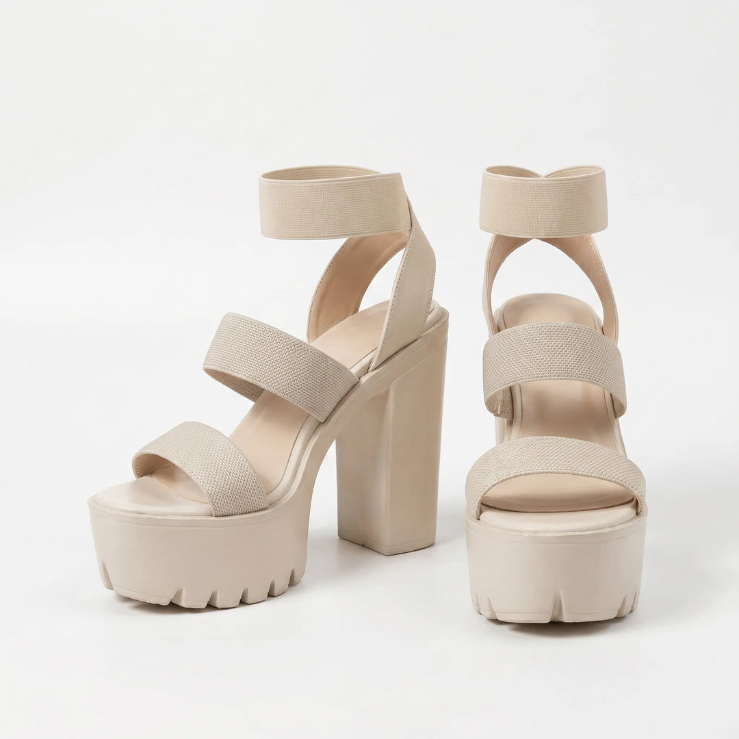 Comfortable slip-on women's platform sandals, featuring a high chunky block heel for casual summer style.