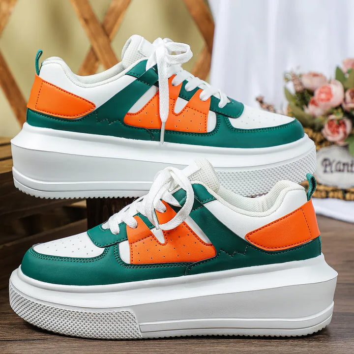 Stylish women's lace-up platform sneakers with perforated details, perfect for a trendy, comfortable casual look.