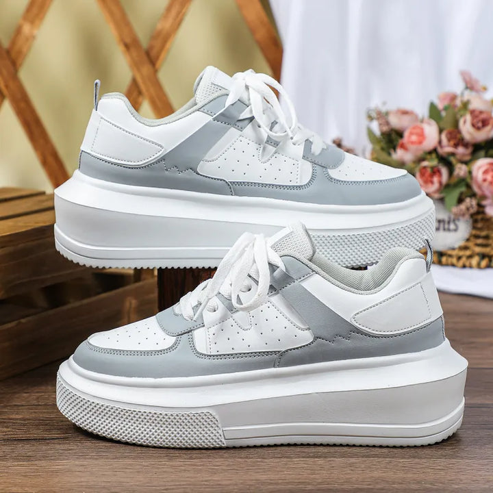 Fashionable women's platform sneakers, featuring trendy perforations and lace-up design, ideal for streetwear style.