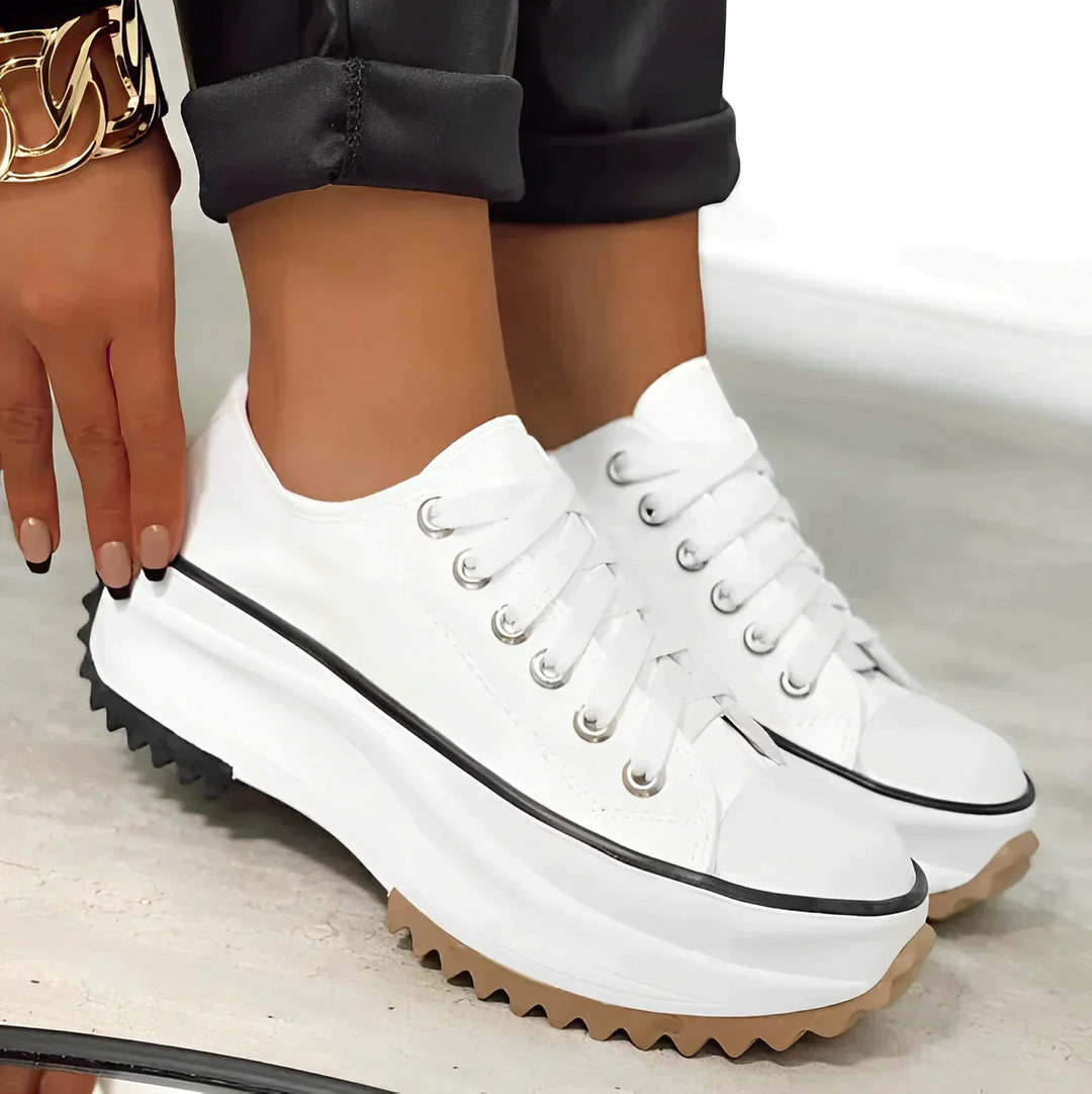 Elevated style women's platform sneakers, providing comfortable support and a sleek, fashionable look.
