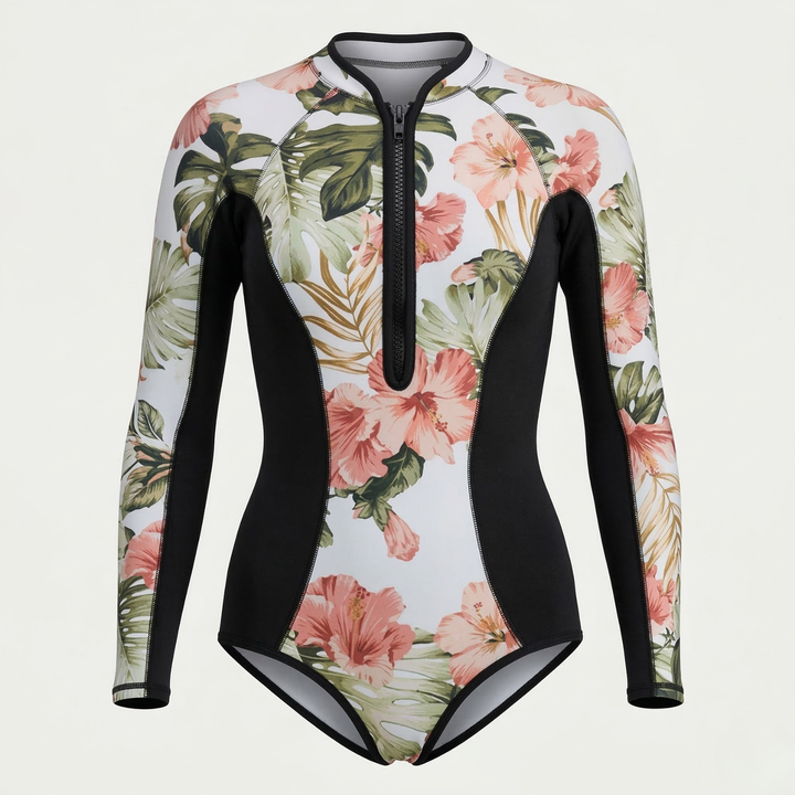 Long sleeve women's active swimwear with tropical design, ensuring UPF 50+ UV protection on the beach.
