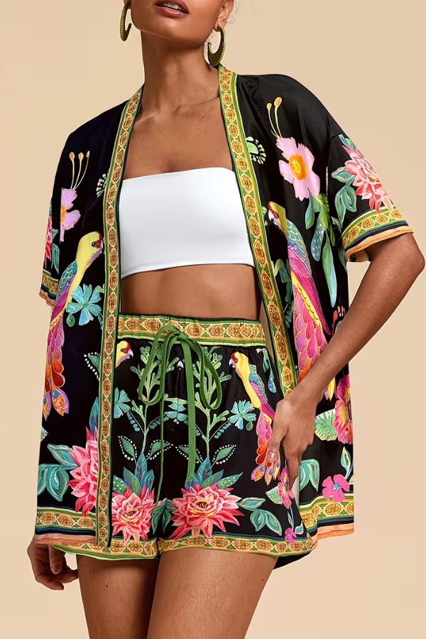 Women's vibrant tropical floral print two-piece shorts set, a stylish summer outfit for resort wear.