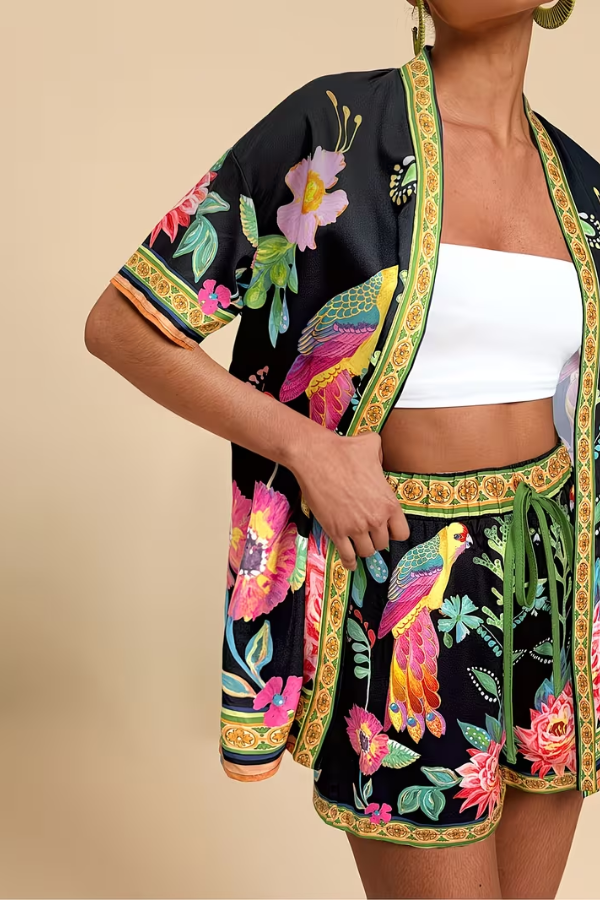 Chic women's tropical print 2-piece summer shorts set, featuring a vibrant floral design, perfect for vacation.