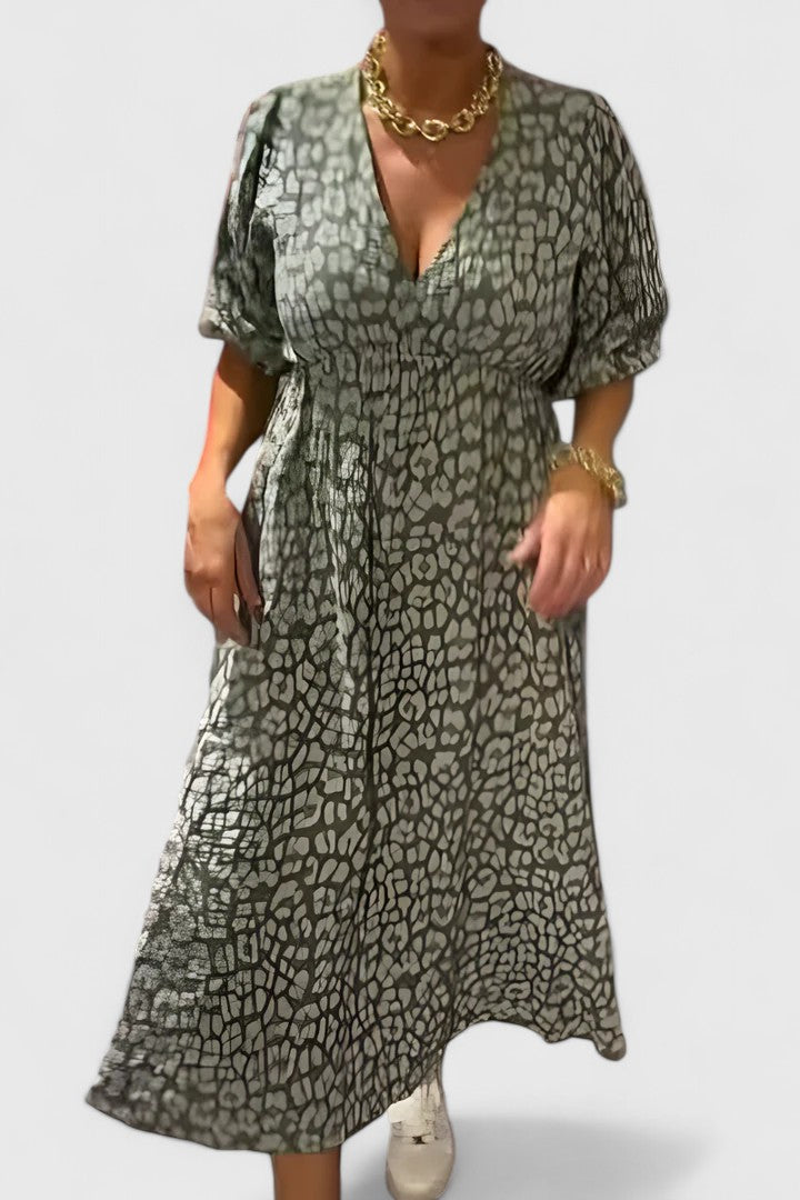 Womens tropical stripe maxi dress: V-neck, puff sleeves, & empire waist. Stylish for summer, beach, or resort fashion.