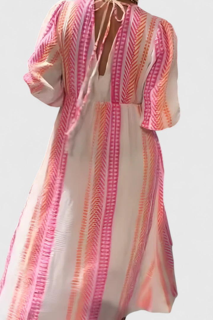Colorful tropical stripe V-neck maxi dress with puff sleeves. Flowing summer fashion for elegant resort & vacation wear.