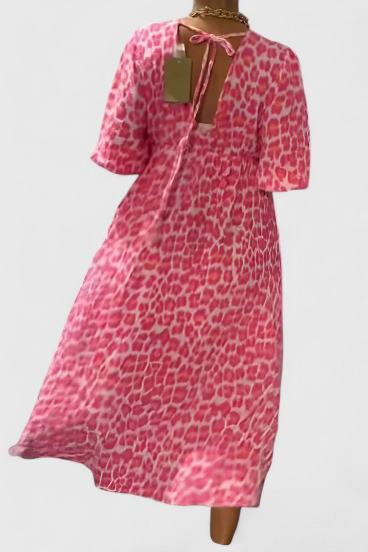 Comfortable women's tropical stripe V-neck maxi dress. Puff sleeves, empire waist, ideal for summer, beach, & resort.