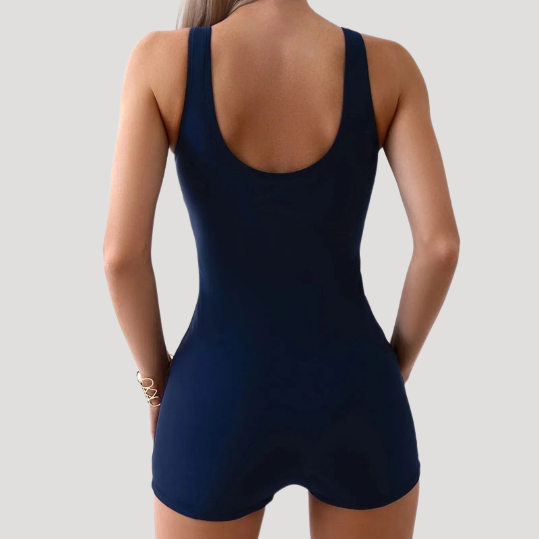 Comfortable women's tummy control swimsuit with shorts, offering a sleek look for beach or pool.