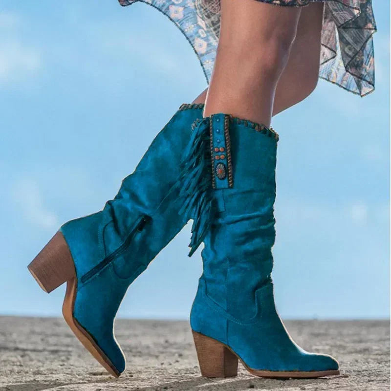 Boho chic women's turquoise studded fringe western boots. Mid-calf design with a comfortable block heel.