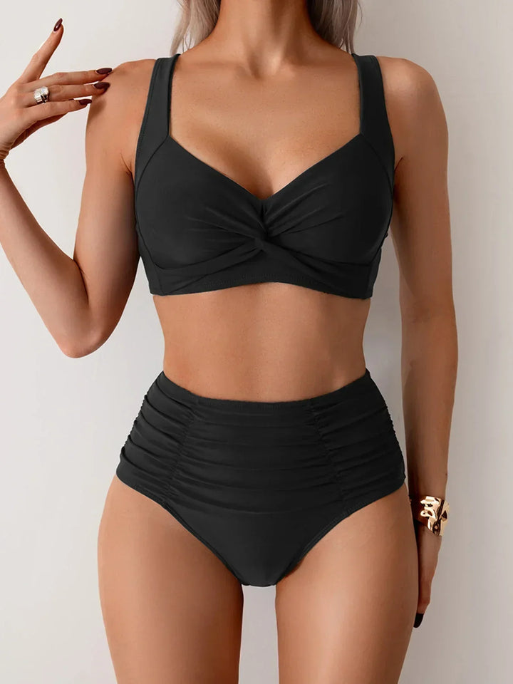 Women's twist front ruched high waist bikini swimsuit set. Flattering beachwear for summer vacation.