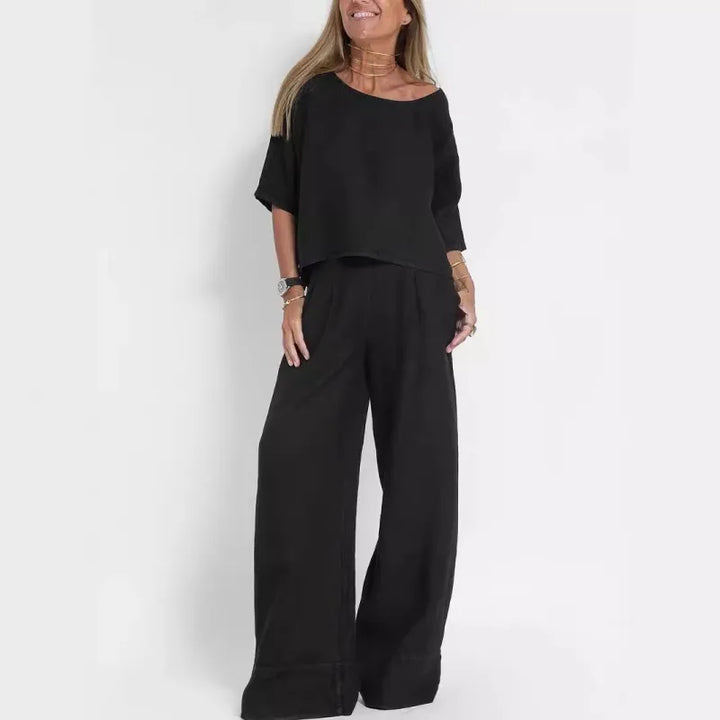 Stylish women's fashion set: cropped boatneck top & flowing wide leg pants outfit.