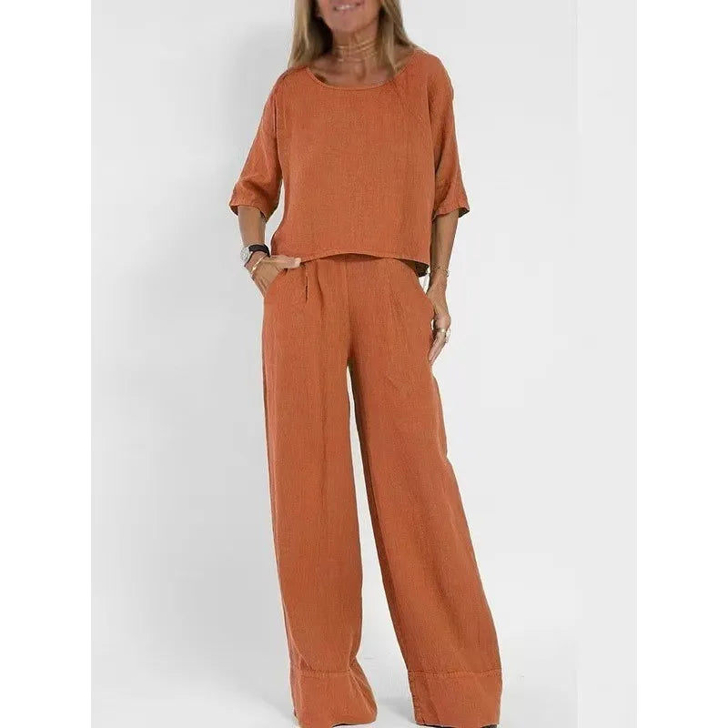 Elegant women's coordinated set: boatneck top and wide-leg trousers for chic lounge.