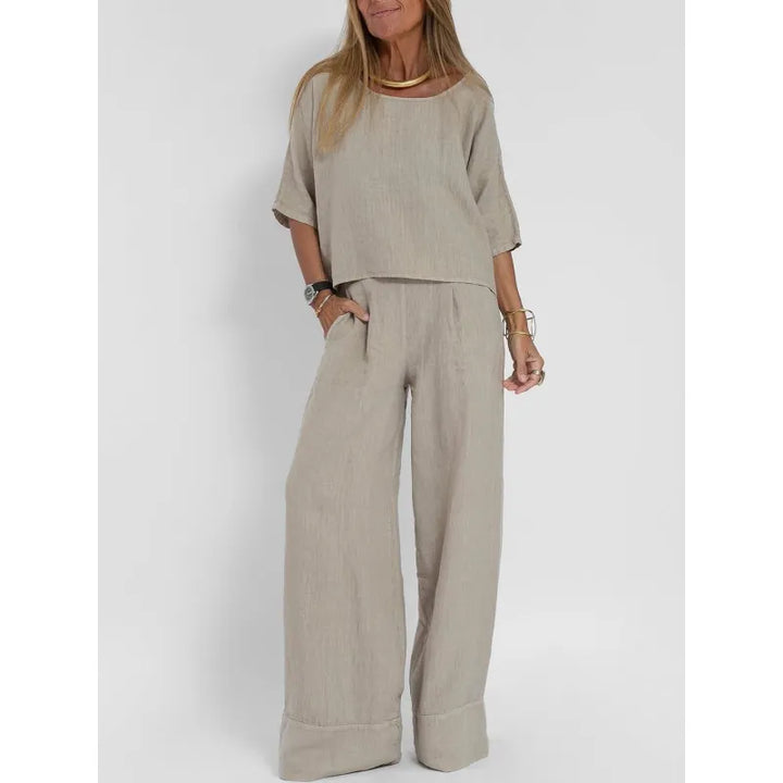 Women's flowy wide leg pants set with a flattering boatneck top, great for relaxed style.