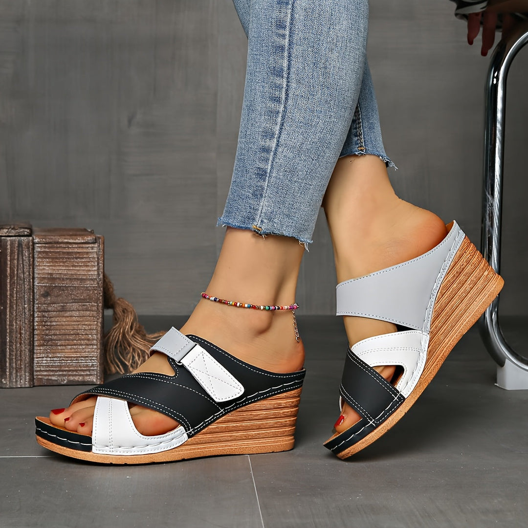 Comfortable women's wedge slides, two-tone slip-on design for stylish summer casual footwear.