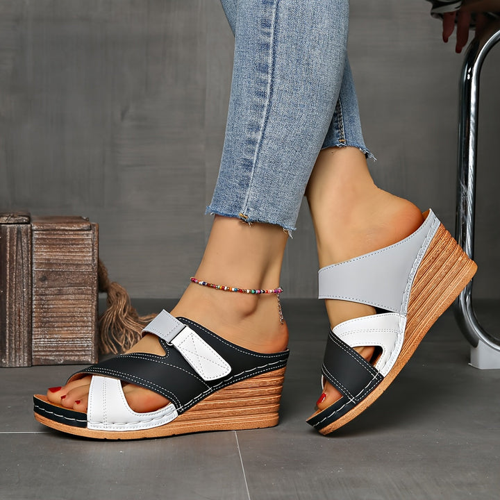 Comfortable women's wedge slides, two-tone slip-on design for stylish summer casual footwear.
