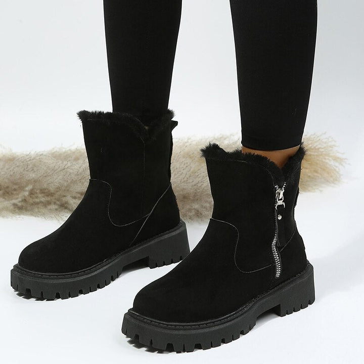 Stylish women's ankle snow boots with slip-resistant sole, perfect for cold winter weather.