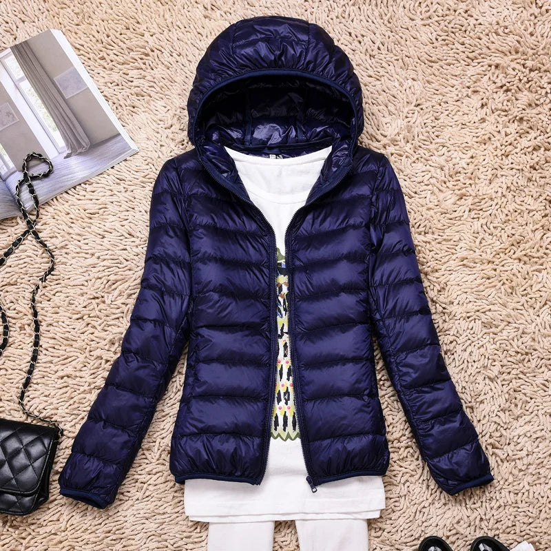 Women's fall fashion insulated jacket, ultralight and hooded for style and winter warmth outdoors.