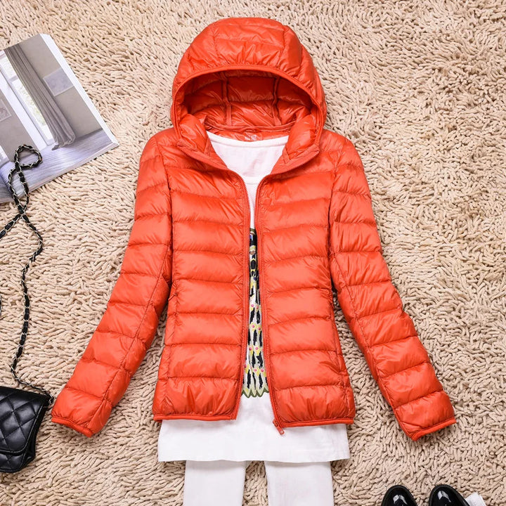 Smart women's ultralight insulated hooded jacket, offering warmth and packable convenience for winter.