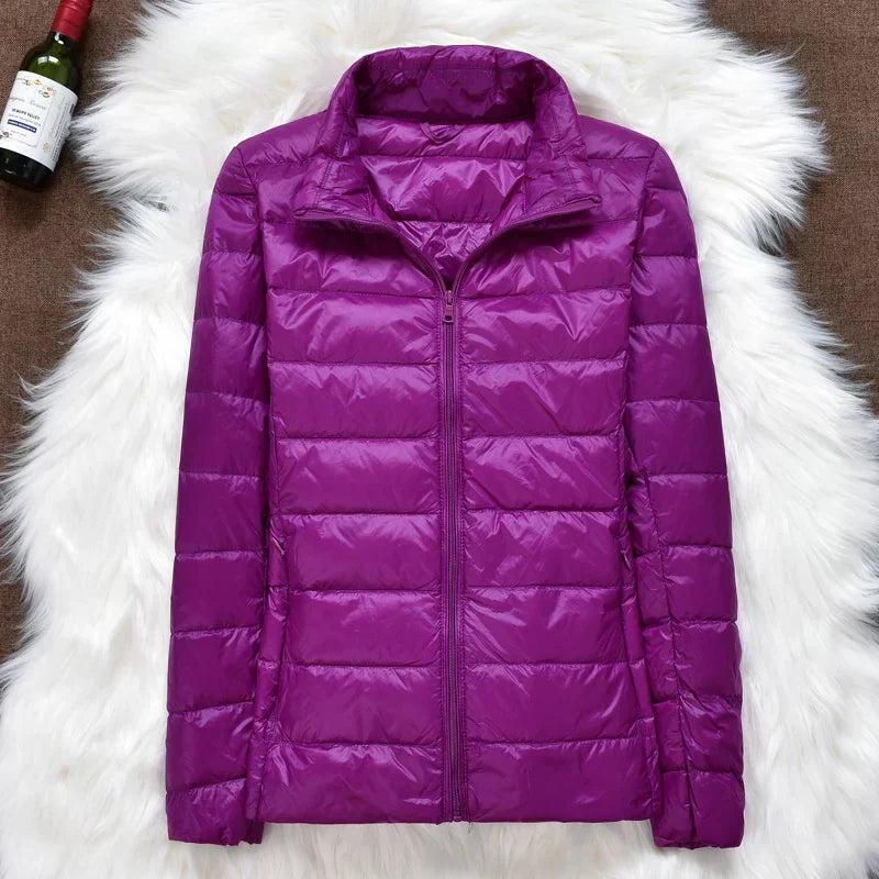Elegant women's ultralight insulated hooded jacket, providing cozy warmth for fall & winter outfits.
