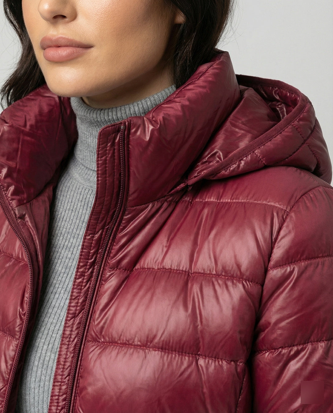 All-season women's ultralight insulated hooded jacket for transitional weather.