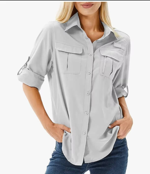 Women's quick-dry hiking shirt with UV protection, long sleeves for sun safety on outdoor trails.