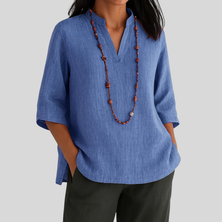 Comfortable women's relaxed fit V-neck blouse with 3/4 sleeves, ideal for versatile spring, summer, and fall fashion.