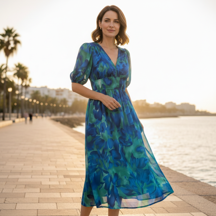 Chic floral V-neck 3/4 sleeve midi dress for women, with a stylish ruched waist detail.
