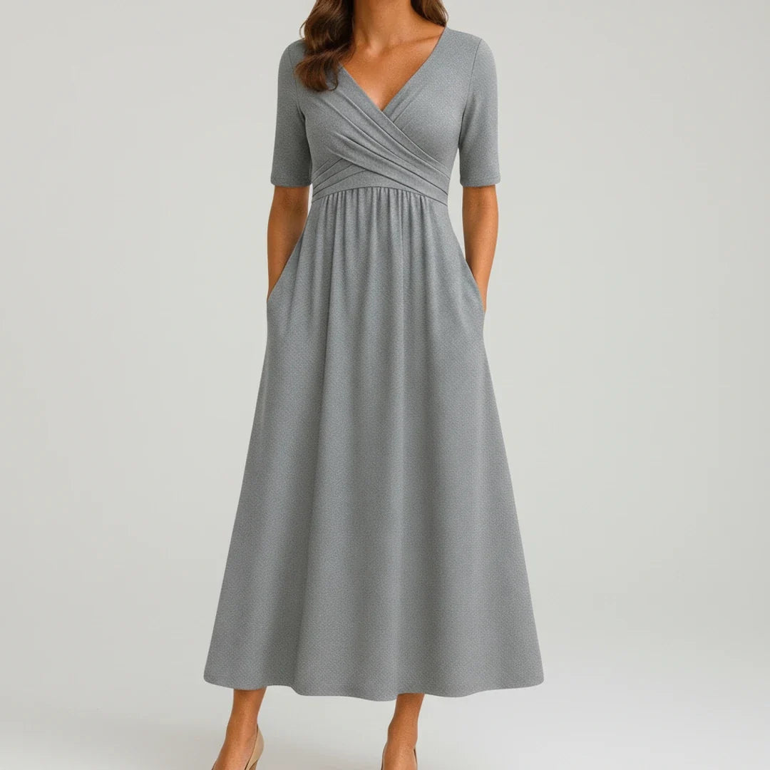 Women's V-neck A-line midi dress with pockets, perfect for casual spring and summer wear.
