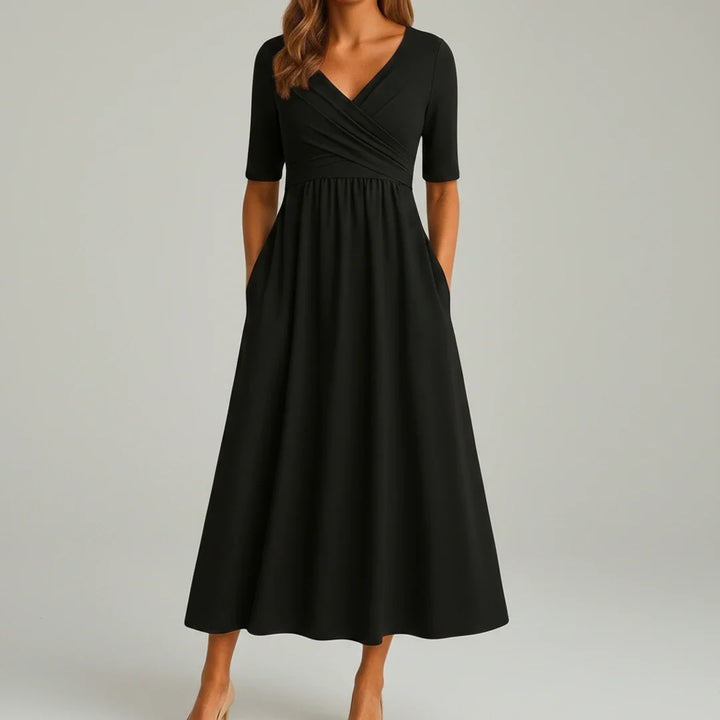 Elegant women's V-neck A-line midi dress featuring convenient pockets, ideal for versatile styling.