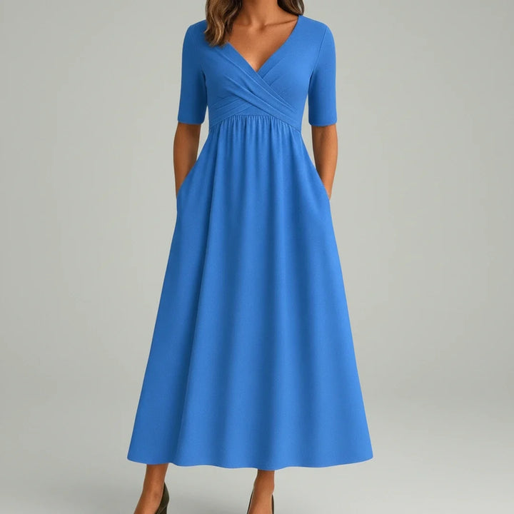 Comfortable flowy A-line midi dress with a flattering V-neckline and practical side pockets for women.