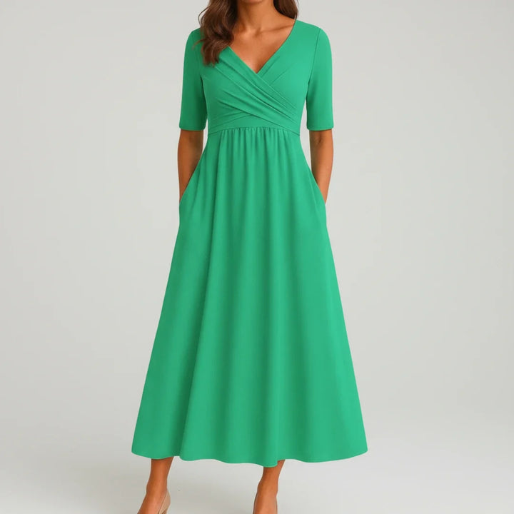 Spring/summer V-neck A-line midi dress for women, designed with a flattering fit and handy pockets.