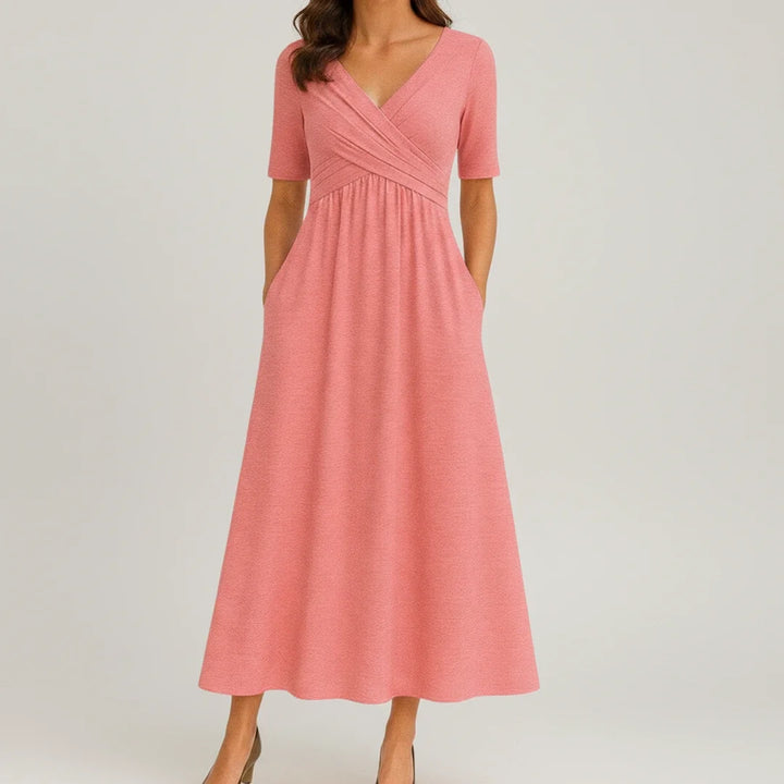 Versatile women's A-line midi dress with V-neck and pockets, perfect for elegant or relaxed occasions.
