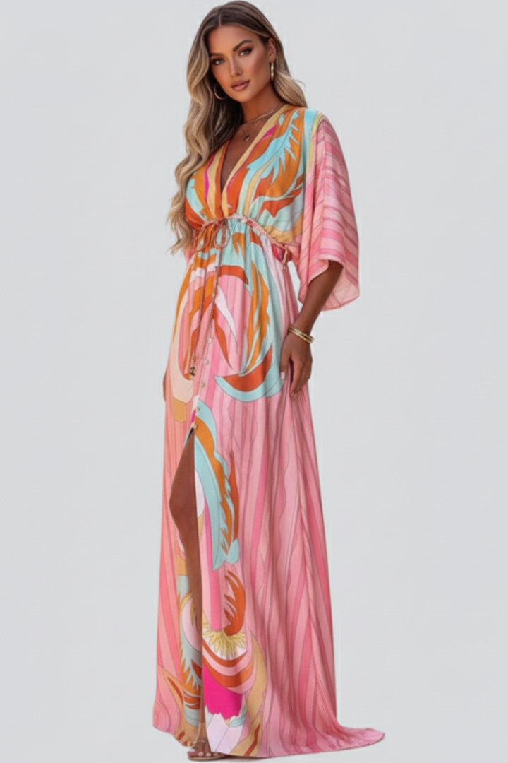Flowy women's abstract print maxi dress featuring a flattering V-neckline and elegant tie belt.