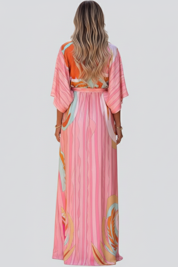 Pink V-neck abstract print long dress for women. Chic belted summer/spring maxi fashion.