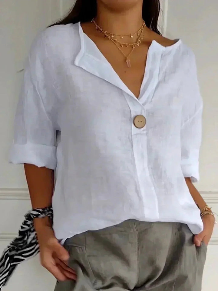 Casual women's V-neck blouse in a relaxed fit. Versatile long sleeve button-down for spring & summer.