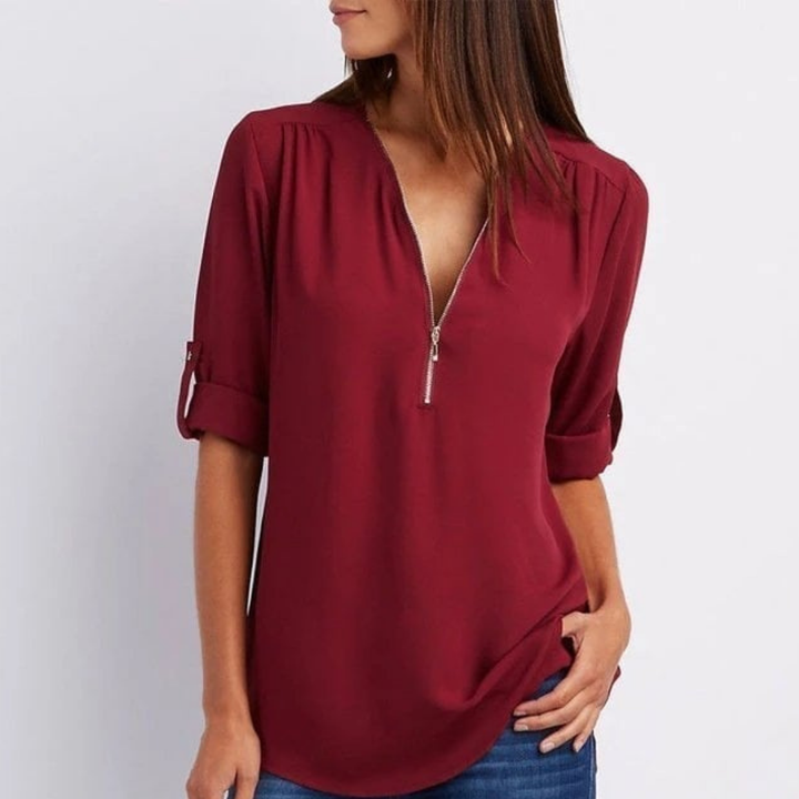 Stylish women's zip-front V-neck blouse, featuring versatile roll-up long sleeves. Great for casual or dressy outfits.