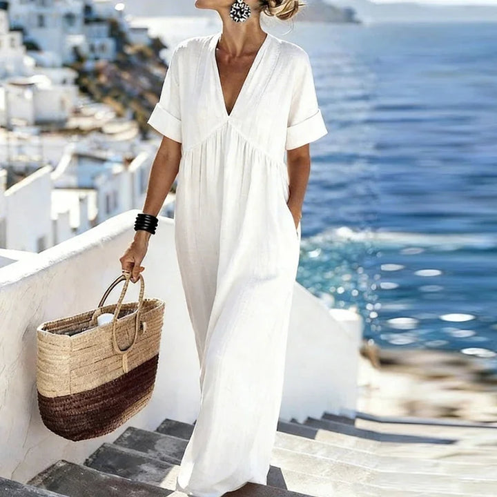 Stylish women's bohemian V-neck maxi dress with practical pockets, a chic choice for summer & vacation wear.