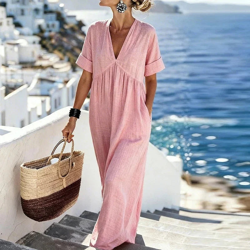 Women's V-neck bohemian maxi dress with pockets, offering a comfortable, flowy fit for summer casual wear.