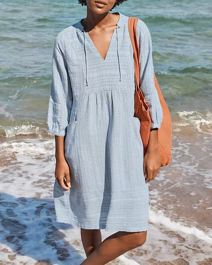 Bohemian V-neck midi dress for women. Comfortable, flowing fabric & relaxed fit for summer casual or vacation.