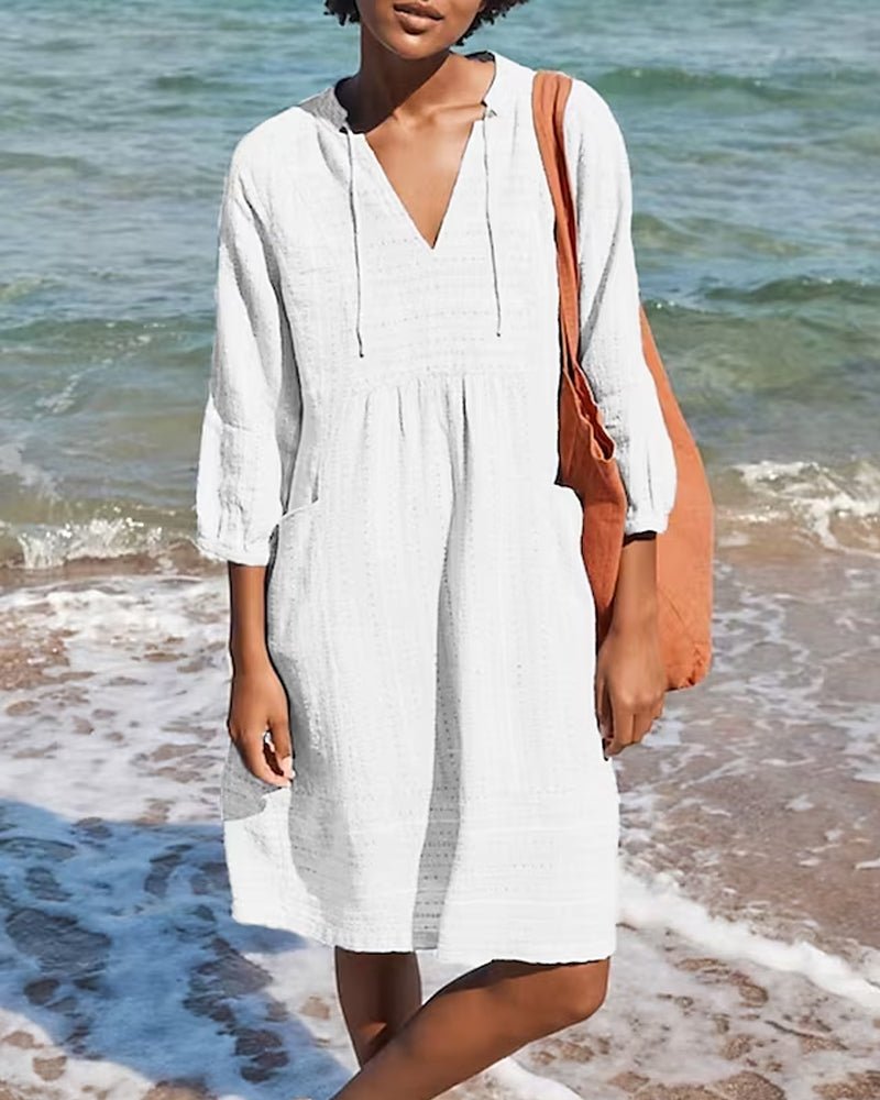 Casual women's V-neck midi dress with a bohemian summer style. Comfortable, flowing, perfect for vacation or daily wear.
