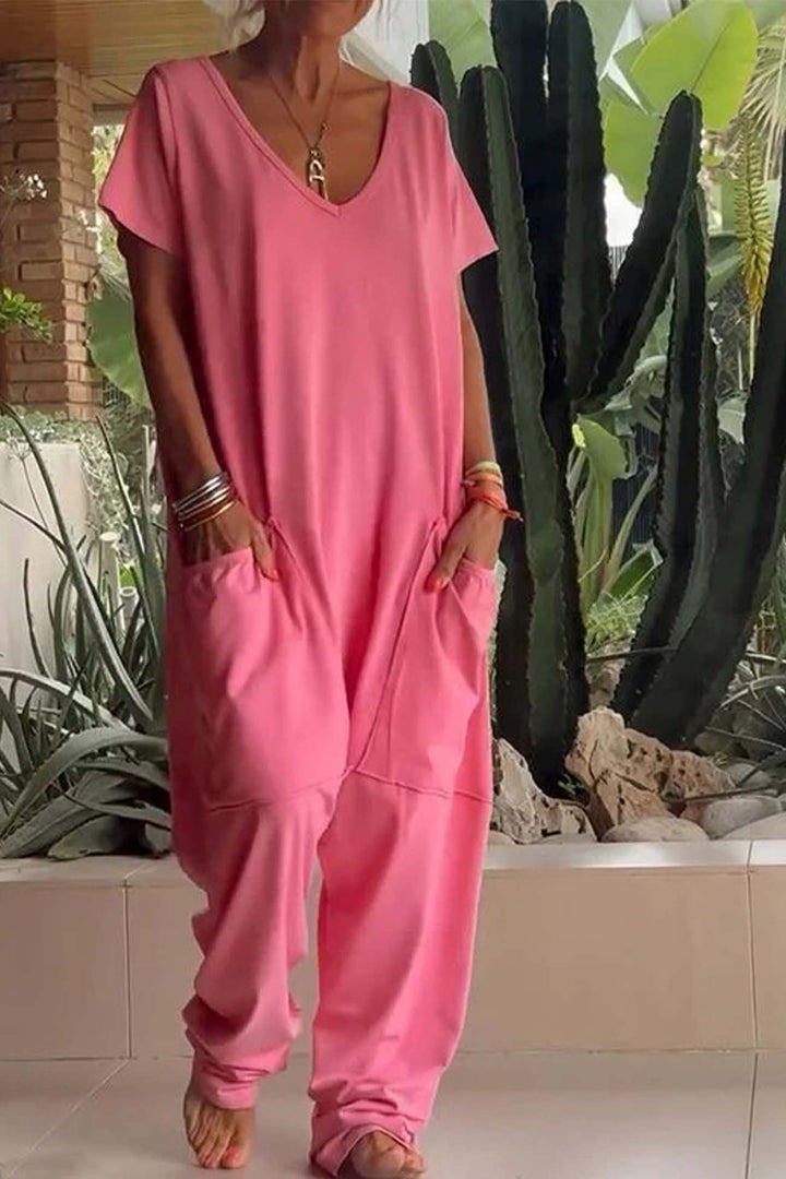 Women's V-neck casual jumpsuit with short sleeves, relaxed fit & stylish dropped crotch for comfort.