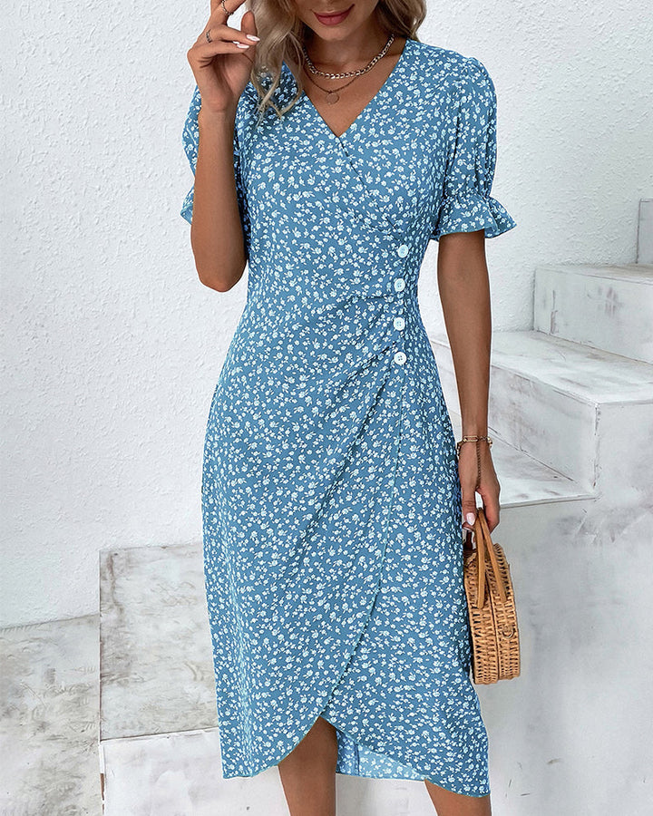 Close-up of the V-neckline and vibrant floral print on a women's comfortable flowy sundress.