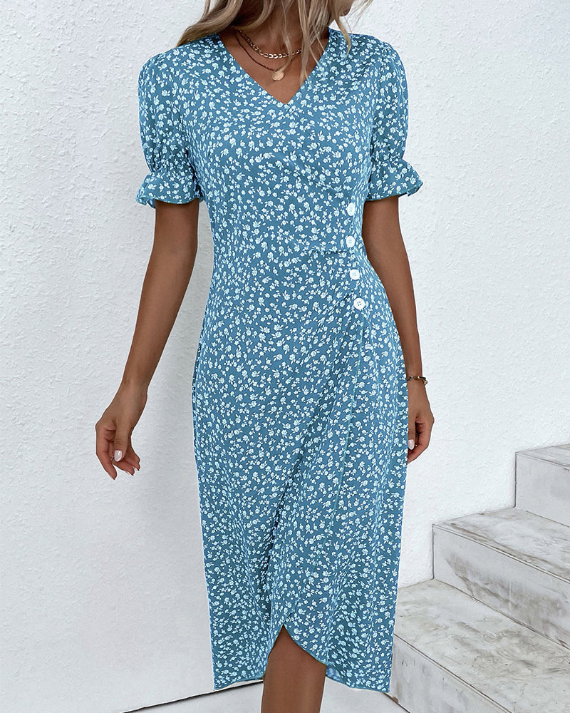 Vibrant floral pattern on a women's flowy V-neck dress, offering a fresh and comfortable spring look.