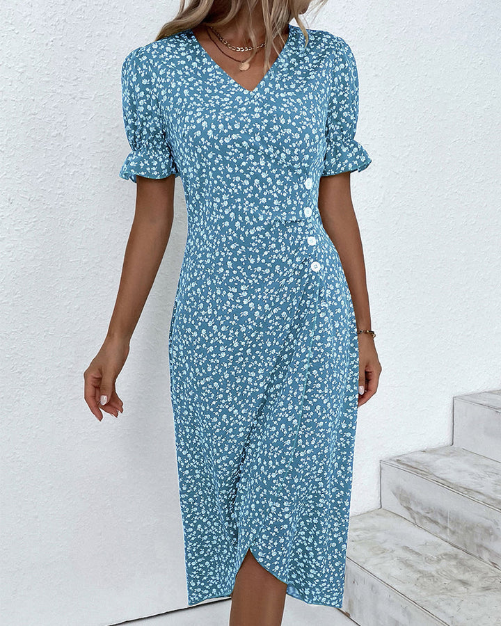 Vibrant floral pattern on a women's flowy V-neck dress, offering a fresh and comfortable spring look.