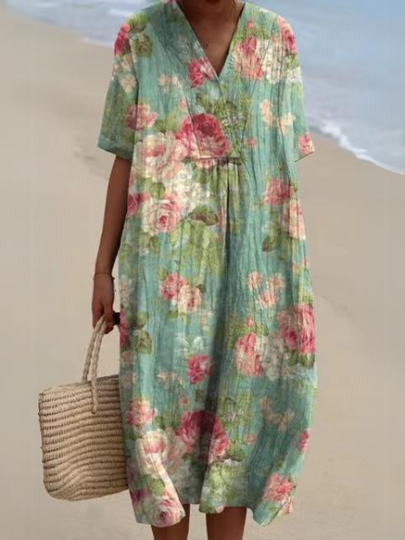 Detailed view of the flattering V-neckline on a women's floral short sleeve midi dress.