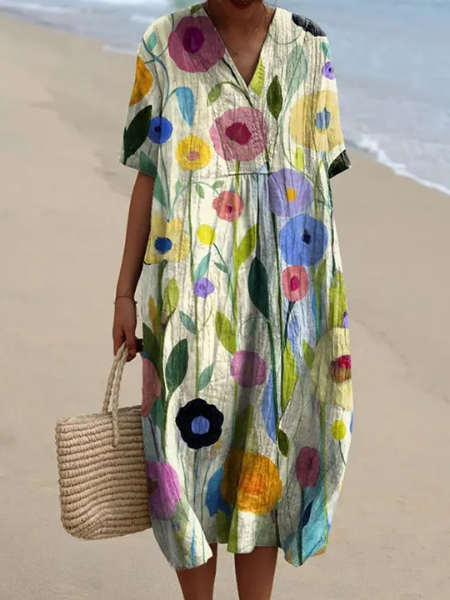 Women's short sleeve floral midi dress with V-neckline and practical pockets for everyday comfort.