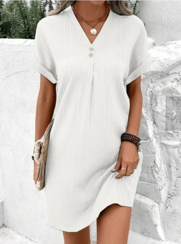 Detailed shot of a women's V-neck flowy spring maxi dress, highlighting soft fabric and elegant floral print.