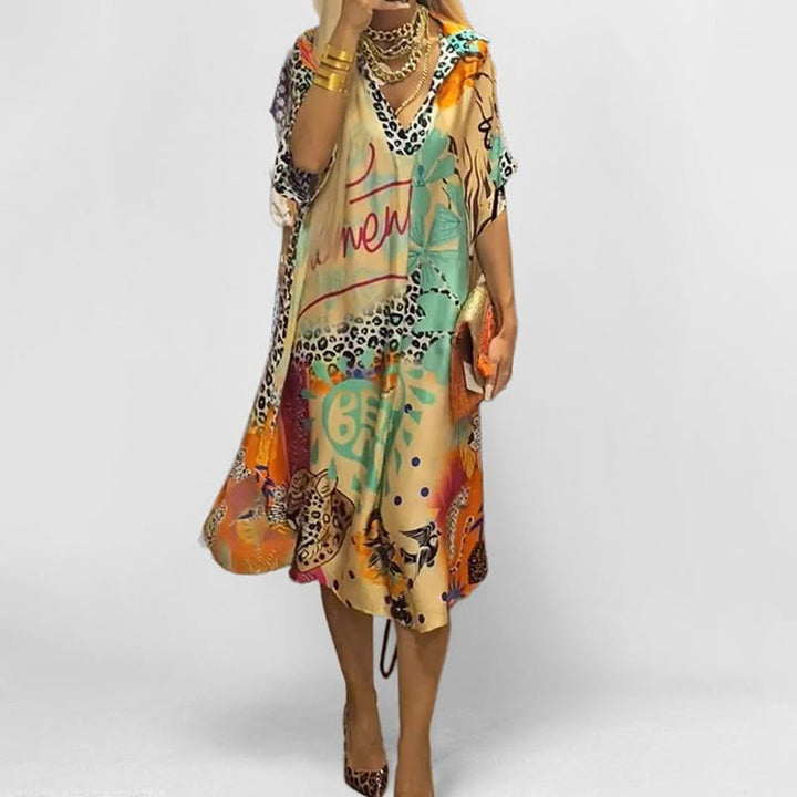 Women's V-neck graphic print swing tunic dress. Relaxed fit short sleeve summer casual dress, perfect for vacation.