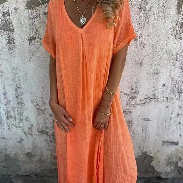 Flowy women's V-neck midi dress with short kimono sleeves, offering a relaxed fit for summer comfort.
