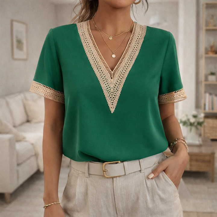 Stylish women's V-neck top with lace trim, designed for effortless spring & summer fashion.